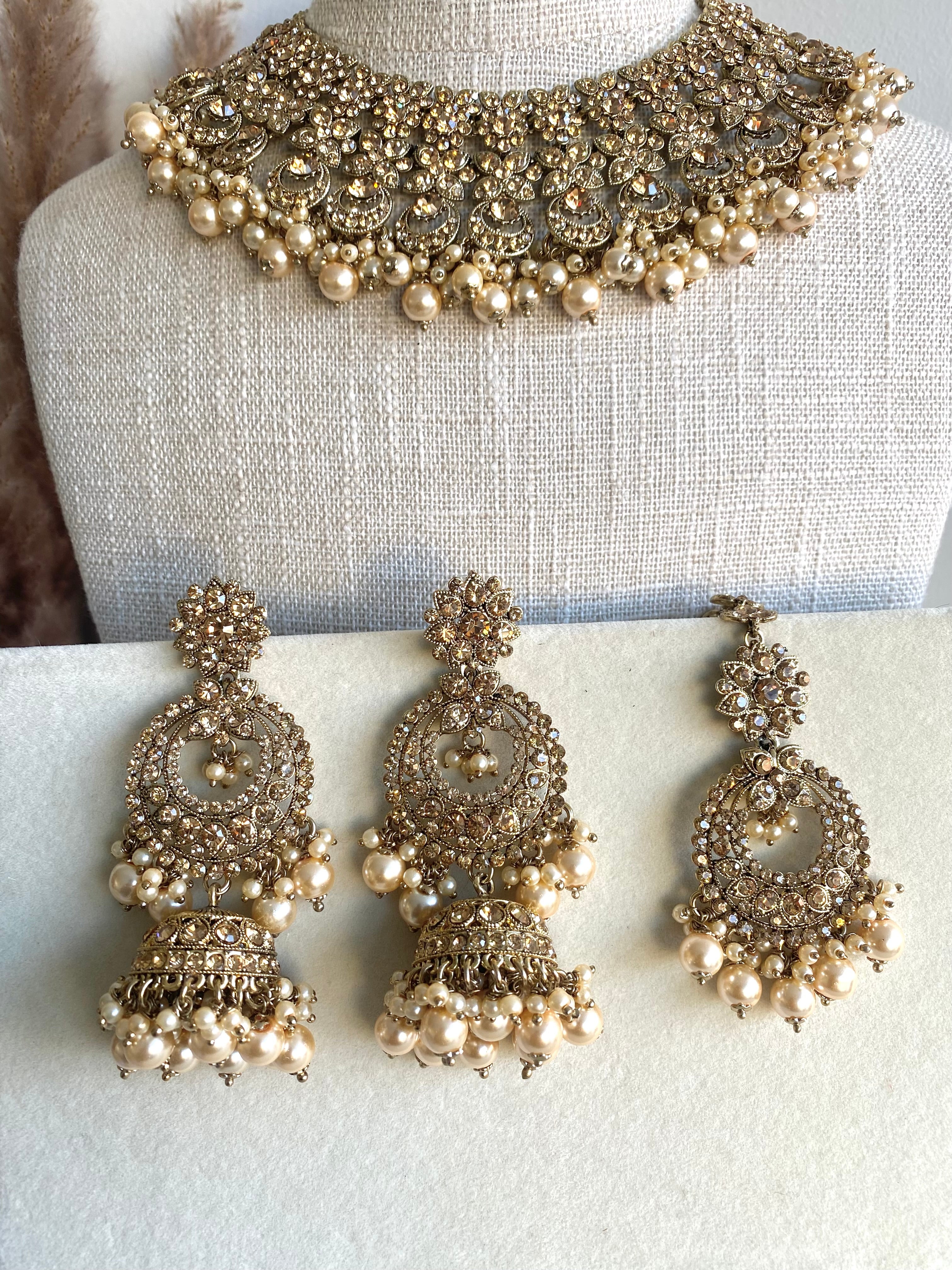 Festive Essentials - Maleena necklace has gold or silver plating with multiple stone and color options. It has a necklace, earrings and tikka. For customization of colors please contact on whatsapp: +1-313-727-1045