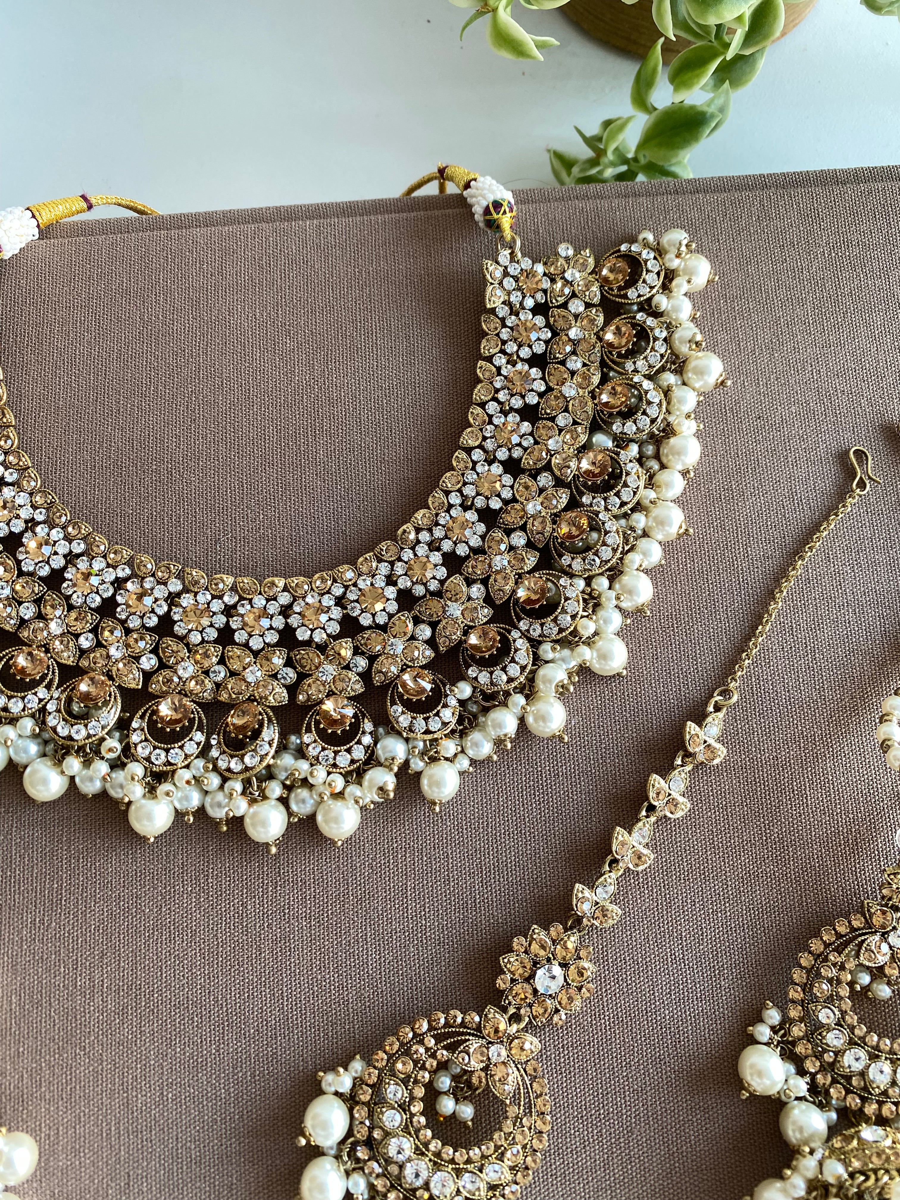 Festive Essentials - Maleena necklace has gold or silver plating with multiple stone and color options. It has a necklace, earrings and tikka. For customization of colors please contact on whatsapp: +1-313-727-1045