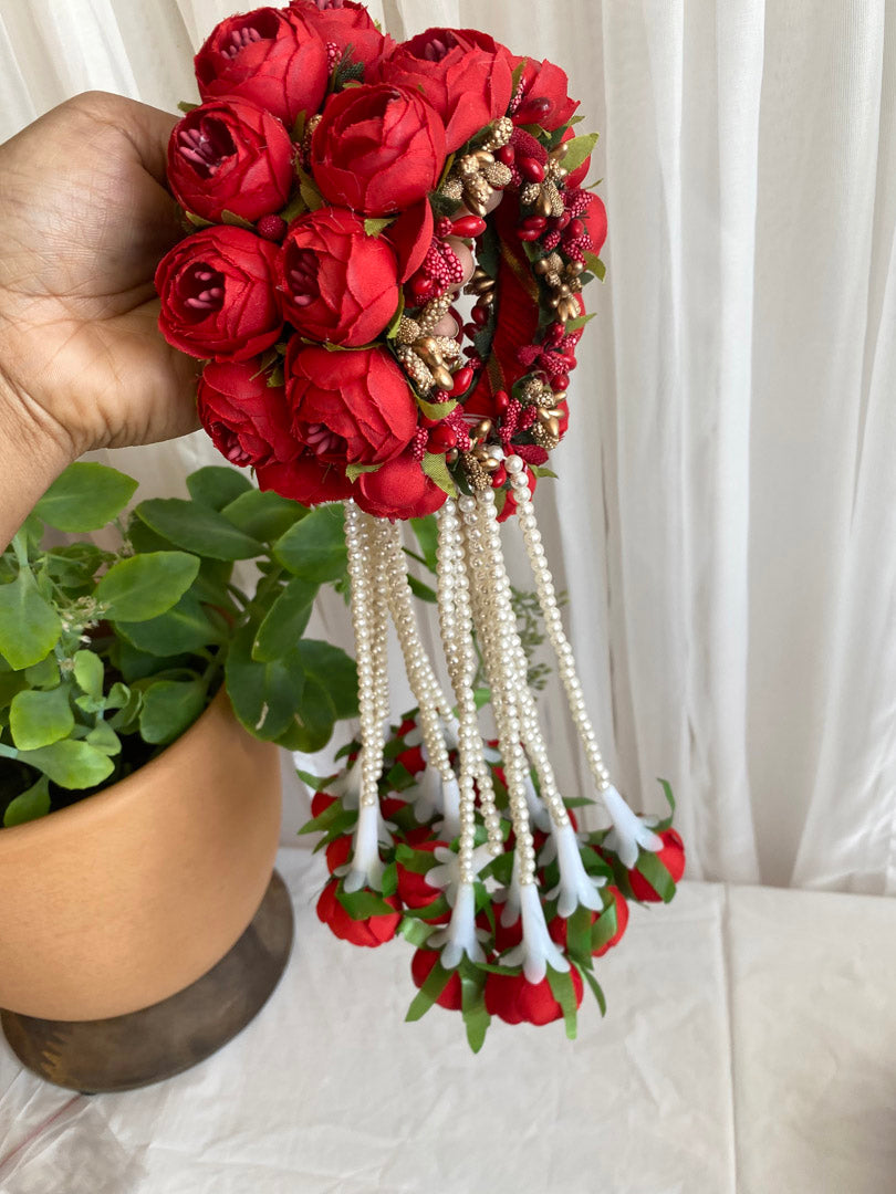 Festive Essentials - Unleash your Beauty with our stunning Reena Floral Hand Sets! Adorned with delicate string beads and charming hanging flowers, these hand sets come in a variety of colors and can also be customized through WhatsApp by ordering at +1313-727-1045. Complete your look with our beautiful Floral hand sets today!