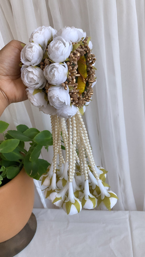 Festive Essentials - Unleash your Beauty with our stunning Reena Floral Hand Sets! Adorned with delicate string beads and charming hanging flowers, these hand sets come in a variety of colors and can also be customized through WhatsApp by ordering at +1313-727-1045. Complete your look with our beautiful Floral hand sets today!