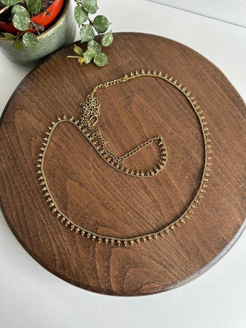 Antique gold waist chain.