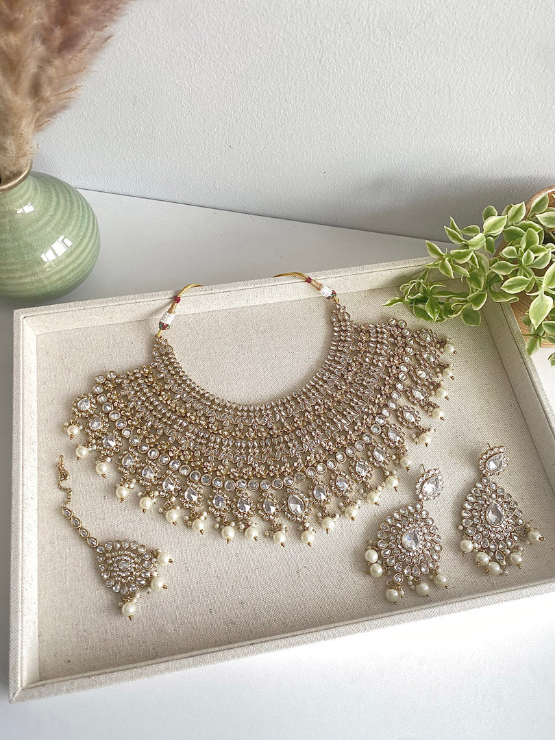 Festive Essentials - Beena bib Bridal set is our pride. It is perfect for those brides looking for heavy necklace with matching earrings and tikka. If you want any specific color other than mention above, and for any other inquiries please contact us on whatsapp at +1(313)7271045.