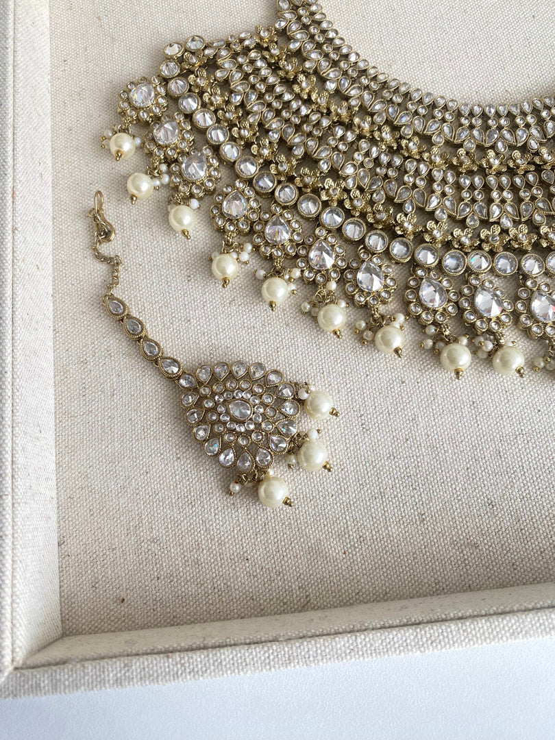 Festive Essentials - Beena bib Bridal set is our pride. It is perfect for those brides looking for heavy necklace with matching earrings and tikka. If you want any specific color other than mention above, and for any other inquiries please contact us on whatsapp at +1(313)7271045.
