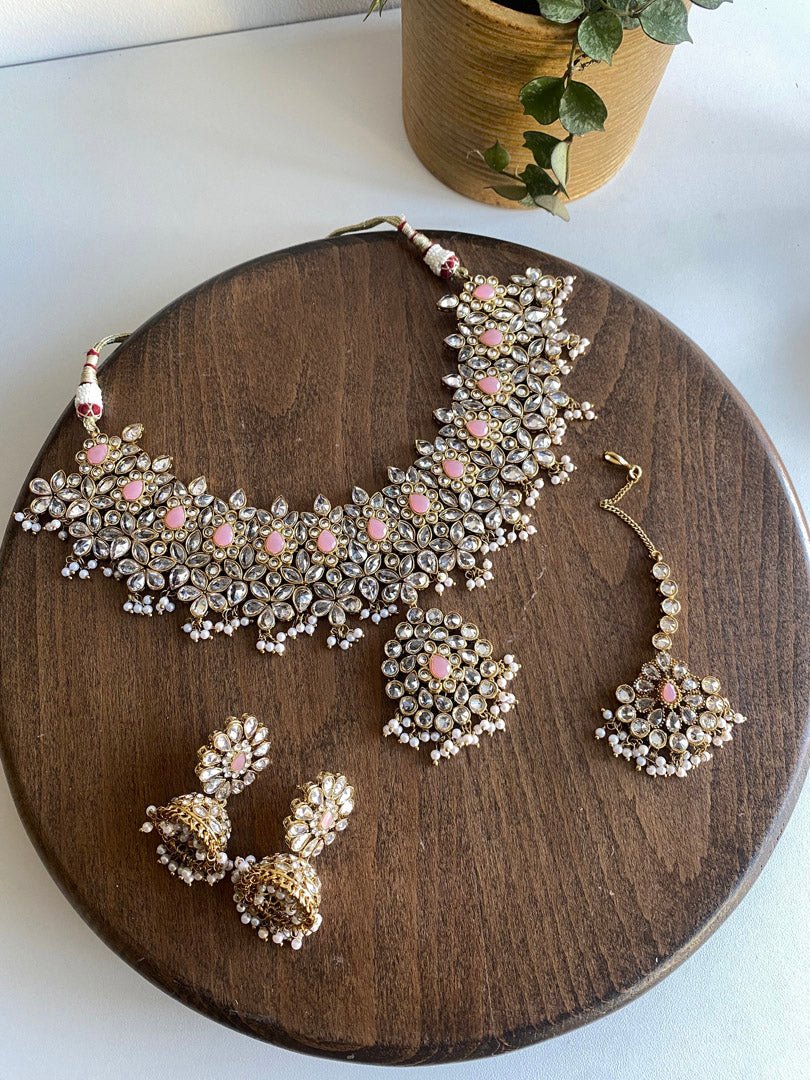 Nusrat bib set is ultimate graceful piece, its&nbsp; flower petal and leaf shape enhaves its beauty. Its gold plating with clear white stone and mint beads combine with pink stone to give you trending look.  If you want any specific color other than mention above, and for any other inquiries please contact us on whatsapp at +1 (313) 727 1045. We are very proud of our highest quality and specialized craftsmanship. Ready to ship from Michigan, United states and we do International Shipping also.