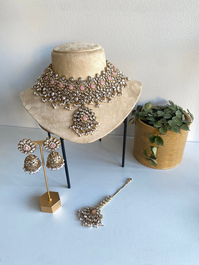 Nusrat bib set is ultimate graceful piece, its&nbsp; flower petal and leaf shape enhaves its beauty. Its gold plating with clear white stone and mint beads combine with pink stone to give you trending look.  If you want any specific color other than mention above, and for any other inquiries please contact us on whatsapp at +1 (313) 727 1045. We are very proud of our highest quality and specialized craftsmanship. Ready to ship from Michigan, United states and we do International Shipping also.
